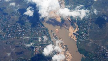 A bird's eye view of the earth. Clouds pass by.